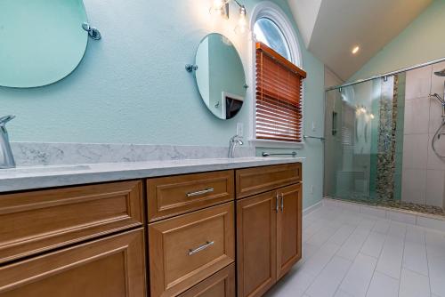 a bathroom with a sink and a shower at Sunset Royale in Duck