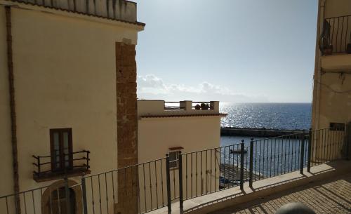 a view of the ocean from the balcony of a building at Summer Dream LA CASA SUL MARE in Trappeto