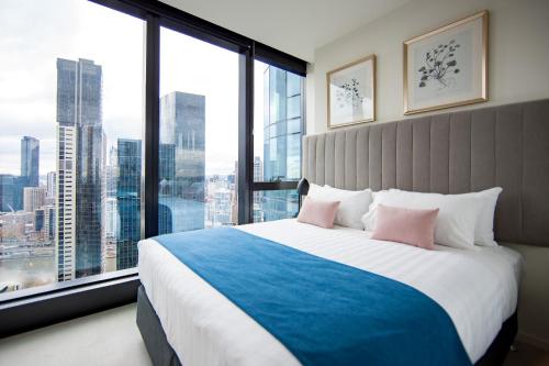 a hotel room with a large window overlooking the ocean at Australia 108 in Melbourne