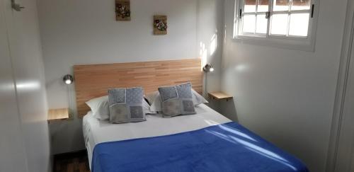 Un pat sau paturi într-o cameră la Squania Suite Container & Monoambientes