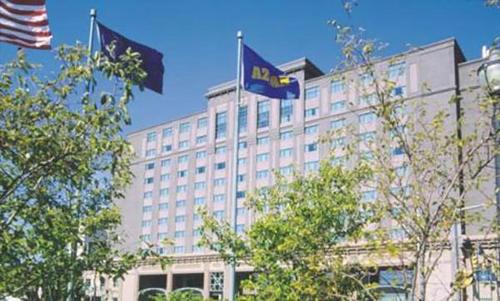 two flags flying in front of a building at Bally's Evansville Casino & Hotel in Evansville