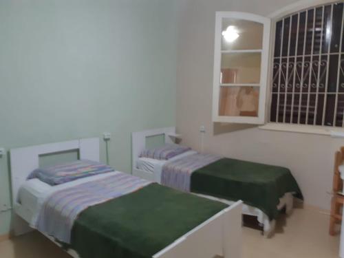 Postel nebo postele na pokoji v ubytování Hospedagem UniCanto