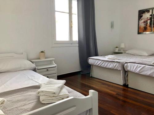 Ένα ή περισσότερα κρεβάτια σε δωμάτιο στο Villa Andros Époque