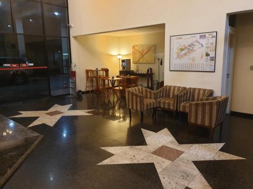 a living room with stars on the floor at Dexter Hotel - Volta Redonda in Volta Redonda