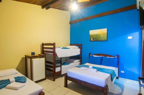 Ein Bett oder Betten in einem Zimmer der Unterkunft Pousada Marendaz