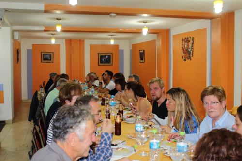 a group of people sitting at a table eating at Intiqa Hotel in Puno