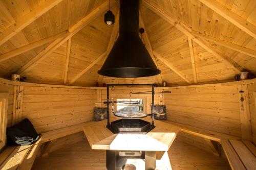 a room with a stove in a wooden cabin at Pokoje Na Szlaku in Lądek-Zdrój