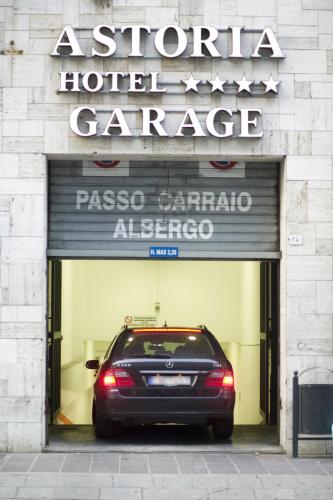 a car parked inside of a hotel garage at Astoria Hotel Italia in Udine