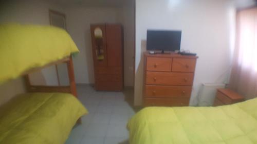 Ένα ή περισσότερα κρεβάτια σε δωμάτιο στο Hotel y Cabañas Rural Mirador del Maipo