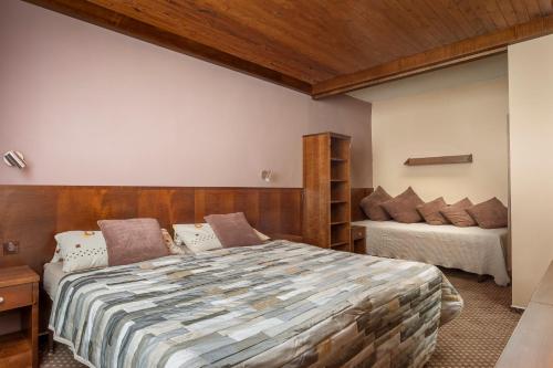 Un ou plusieurs lits dans un hébergement de l'établissement Hotel Tetřeví Boudy