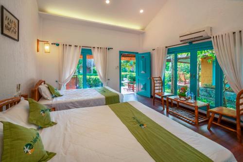 Ένα ή περισσότερα κρεβάτια σε δωμάτιο στο Mekong Lodge Resort