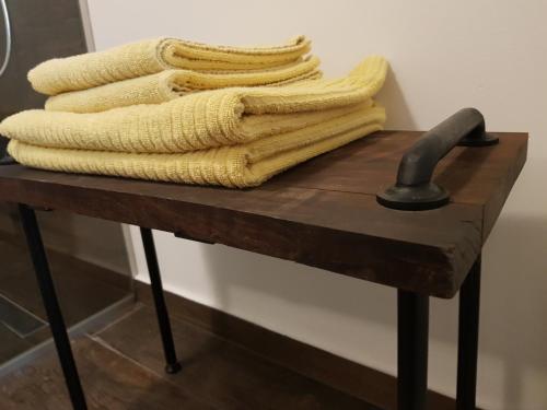 a pile of towels sitting on top of a table at Guesthouse S in Luče