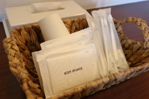 a basket filled with boxes and other items on a table at Pension Bloom in Gujo