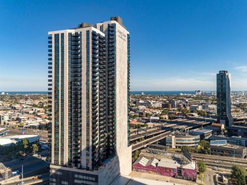 an aerial view of a city with tall buildings at Imagine Marco in Melbourne