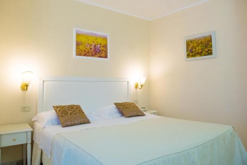 Postel nebo postele na pokoji v ubytování Hotel Seggio