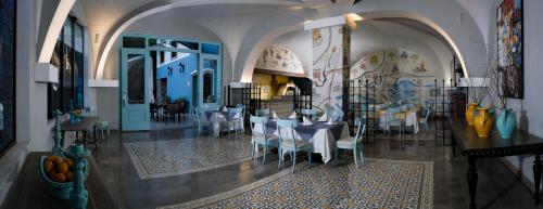 Reštaurácia alebo iné gastronomické zariadenie v ubytovaní Villa Maria Cristina Hotel