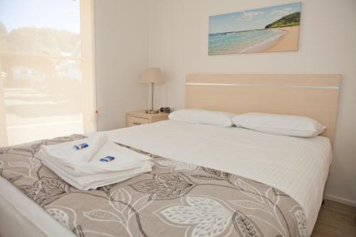 Cama o camas de una habitación en Blue Lagoon Beach Resort