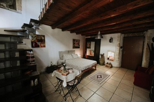 a bedroom with a bed and a table in a room at antonella home in Brindisi