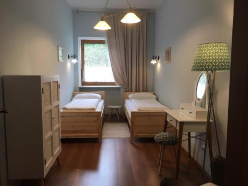 Posteľ alebo postele v izbe v ubytovaní Helenental Pension & Apartments