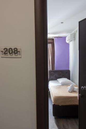 Postel nebo postele na pokoji v ubytování Cosmopolit