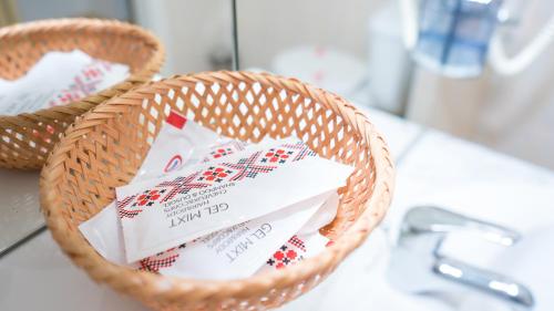 a wicker basket filled with cards on a counter at Hotel TEX Club in Botoşani