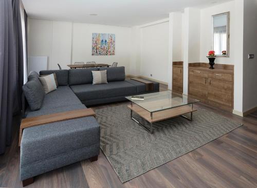 a living room with a couch and a coffee table at Princess Residence in Istanbul
