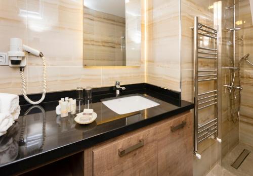 a bathroom with a sink and a shower at Princess Residence in Istanbul