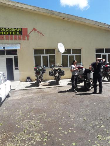 a group of motorcycles parked in front of a building at Javakhet in Ninotsminda