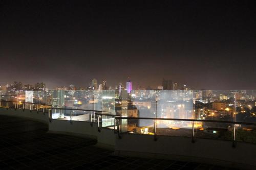 a view of the city at night at Hotel Atrium Plaza in Barranquilla