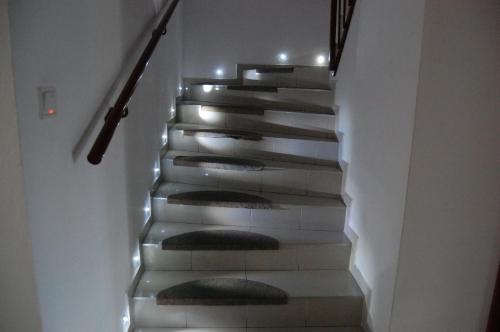 a stairway with lights on the sides of it at Penzion Jarka in Bratislava