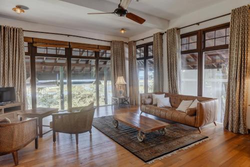 a living room with a couch and a table at The Postcard Galle in Galle