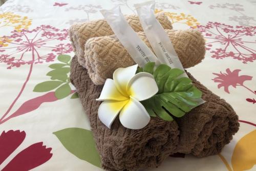 a teddy bear with a flower on it at TerraceRin YN14 in Tomigusuku