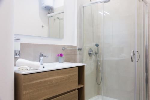 a bathroom with a sink and a shower at Villa Mallandrino in Mondello
