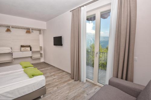 Posteľ alebo postele v izbe v ubytovaní Verdeulivo Relax Home - Ruculì Hospitality