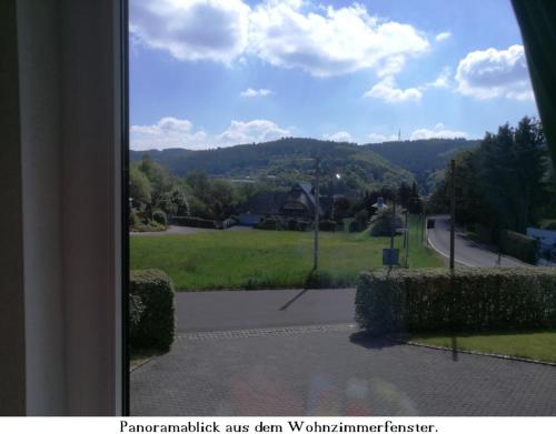 a view from a window of a street with a mountain at Ferienwohnung Gross B in Schleiden