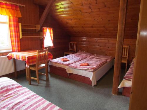 Postel nebo postele na pokoji v ubytování Chata Betyna