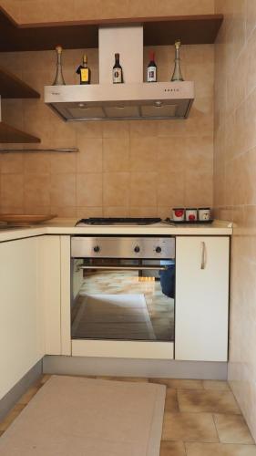 a kitchen with an oven in a kitchen at Ferrari Suite Modena in Modena