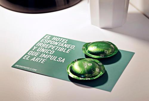two green balls sitting on top of a book at One Shot Prado in Madrid