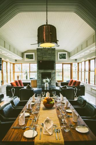 a dining room with a long table with wine glasses at Galgorm in Ballymena