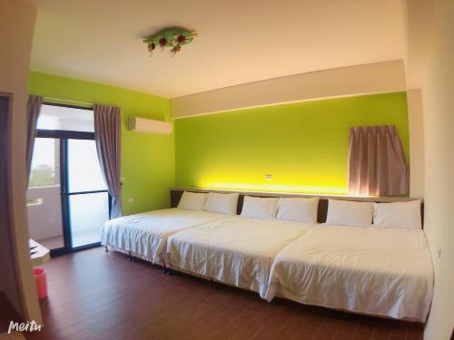 Postel nebo postele na pokoji v ubytování Tang Guo Homestay