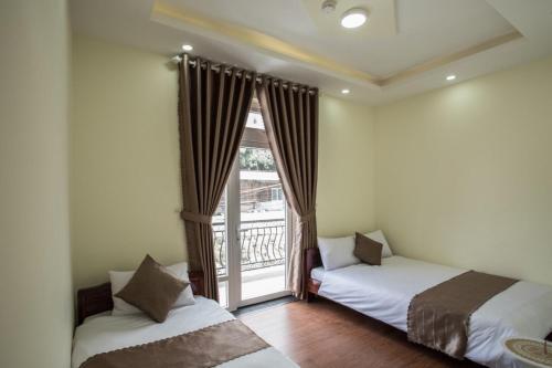 Voodi või voodid majutusasutuse LuTo Hotel toas