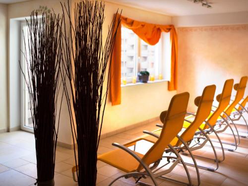 a row of chairs in a waiting room at Landhaus Gastein in Dorfgastein