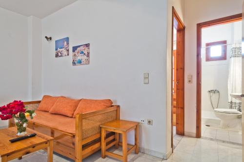 a living room with a couch and a table at Sea Stone Hotel in Karpathos