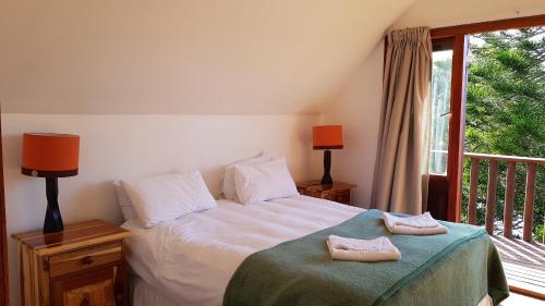Ένα ή περισσότερα κρεβάτια σε δωμάτιο στο Pirates Creek Self-Catering Chalets