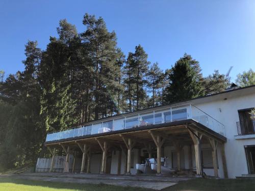 a building with a balcony on top of it at Krokodyl Sport&Spa in Mielno