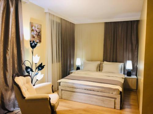 En eller flere senge i et værelse på Holiday House Green Cape Batumi