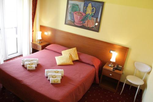 Katil atau katil-katil dalam bilik di Hotel Lugano
