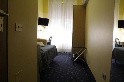 Katil atau katil-katil dalam bilik di Hotel Lugano