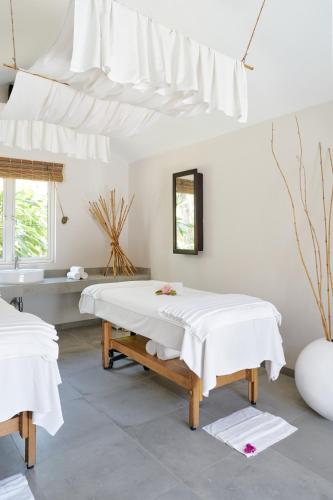 a white room with two beds and a sink at Lagoon Attitude (Adults Only) in Cap Malheureux
