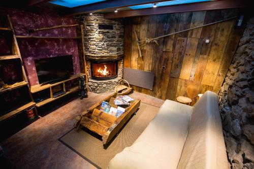 an overhead view of a living room with a fireplace at R de rural - Casa Mariola in Ordino